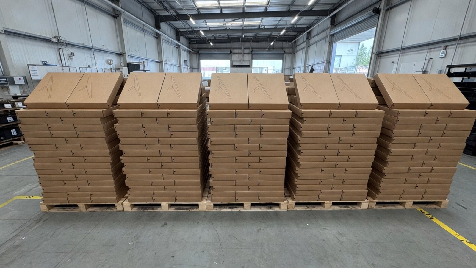 Pallets of boxed Starlink Mini dishes staged in the Veritas warehouse