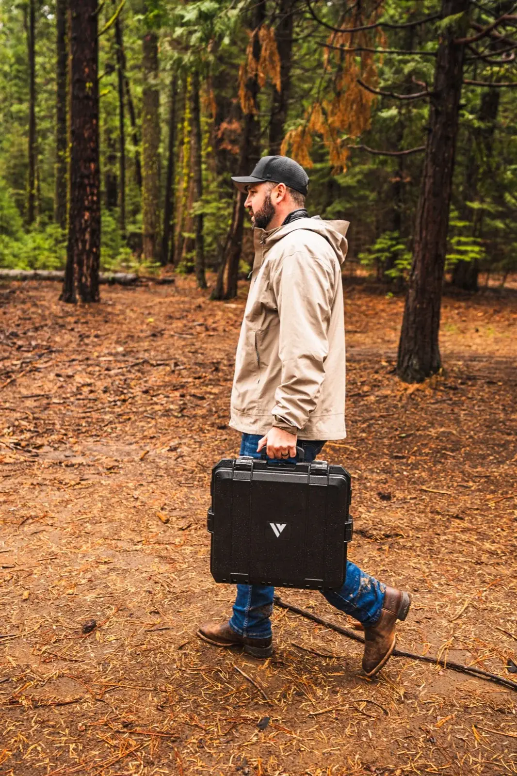 Veritas Starlink case being carried through the woods
