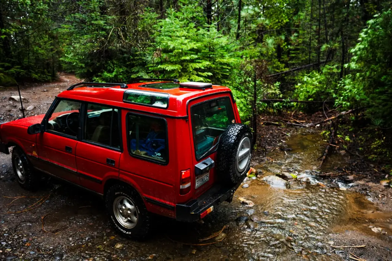 Starlink Mini on a Veritas mount on a Land Rover at a creek